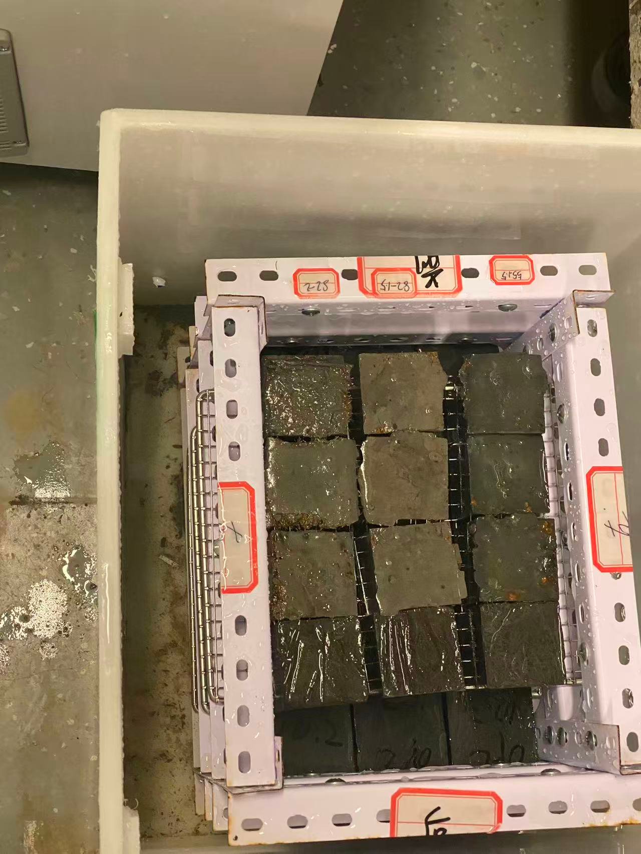 Concrete cube specimens stored in water for curing