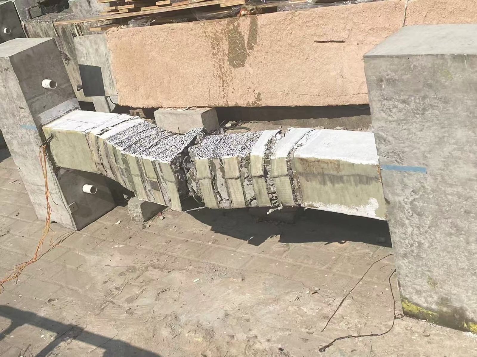 Damaged beam specimen after structural loading test